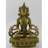 A Tibetan bronze study of a deity sittin