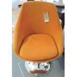 A 1960s swivel chair upholstered in oran