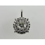 An 18ct white gold diamond cluster penda