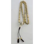 A Tibetan bone necklace, incorporating o