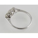 An 18ct white gold diamond three-stone r