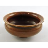 A treacle glaze water bowl, with everted