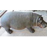 A cast resin hippopotamus, L.76cm.