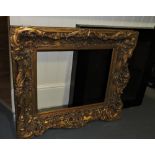 An ebonised box frame with a wood grain