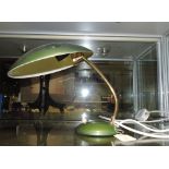 A retro style olive green desk lamp, the