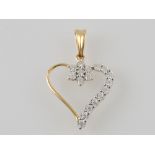 An 18ct yellow gold diamond heart pendan