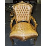 A carved giltwood fauteuil, with button