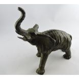 A bronze model of bull elephant, tusks r