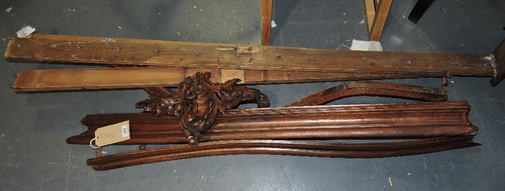 A late Victorian walnut bed canopy, the