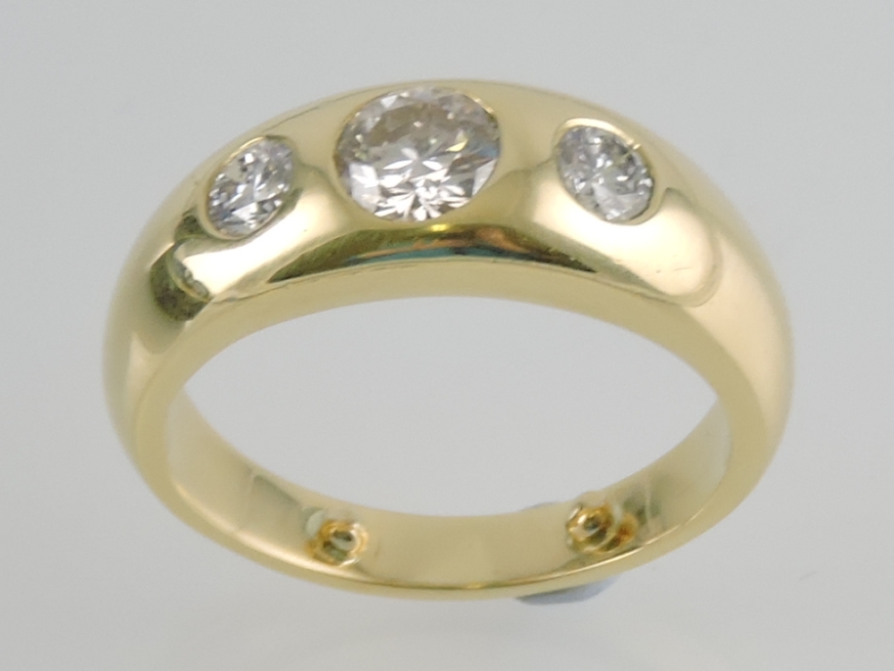 An 18ct gold gent's three-stone diamond