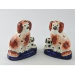 A pair of Staffordshire spaniels, with i