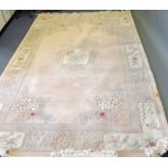A 20th century Chinese sculpted rug, wit