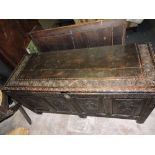 A 17th century style carved oak coffer,