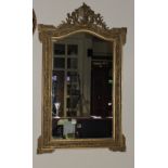 A Victorian gilt plaster wall mirror, wi