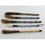 Five Chinese ceramic calligraphy brushes