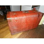 A red painted weave style manner  trunk