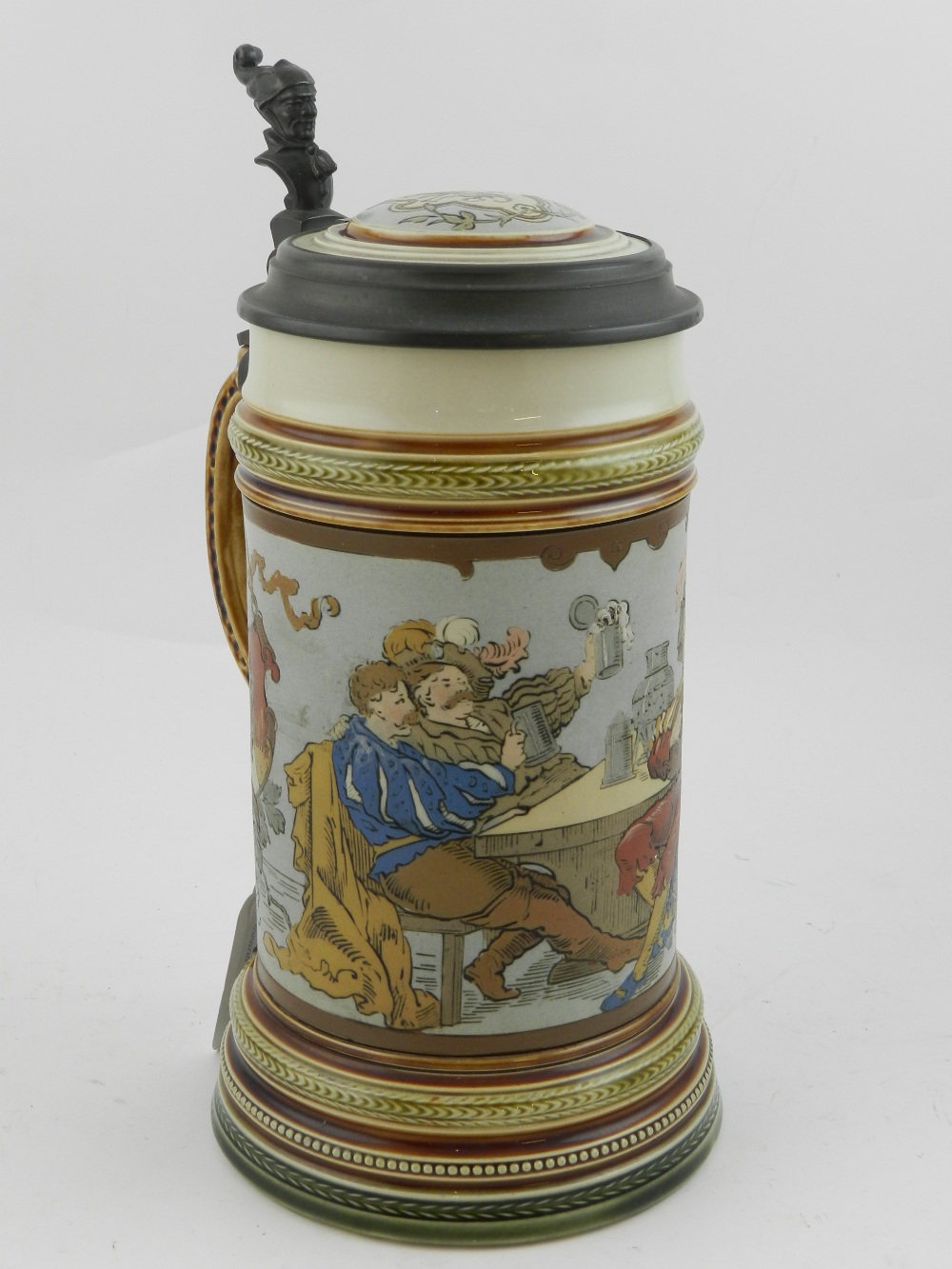A Mettlach tankard, with a pewter hinged