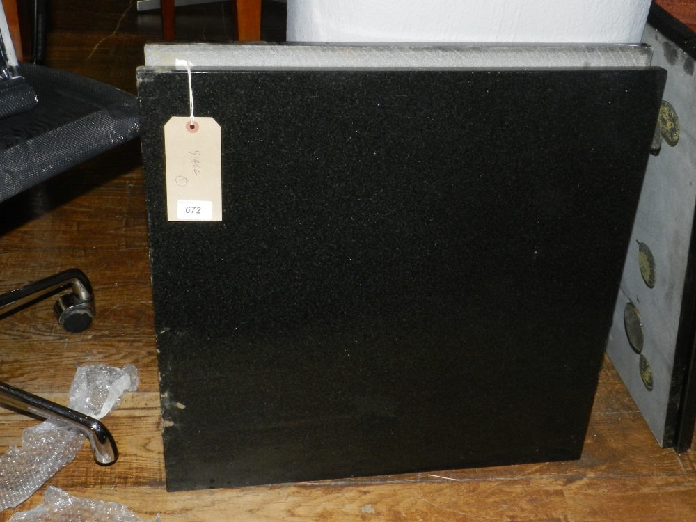 A pair of black granite table tops.  60c