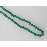 A green hardstone beaded necklace, havin