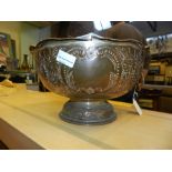 A twin handled footed metal bowl, repous