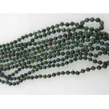 Five green hardstone beaded necklaces