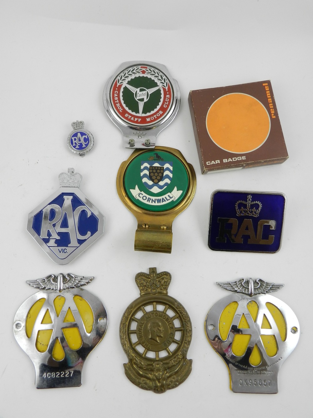 A quantity of car badges, including 'AA'