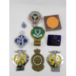 A quantity of car badges, including 'AA'