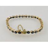 A sapphire and diamond line bracelet, th