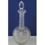 A clear cut glass decanter, with globe s