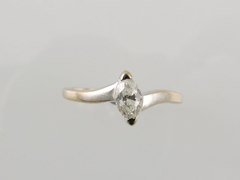 A marquise cut diamond ring, set in a wh
