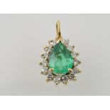 An emerald and diamond set pendant, in a