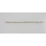 An 18ct gold diamond line bracelet, with