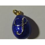 A Russian blue enamel egg shaped pendant