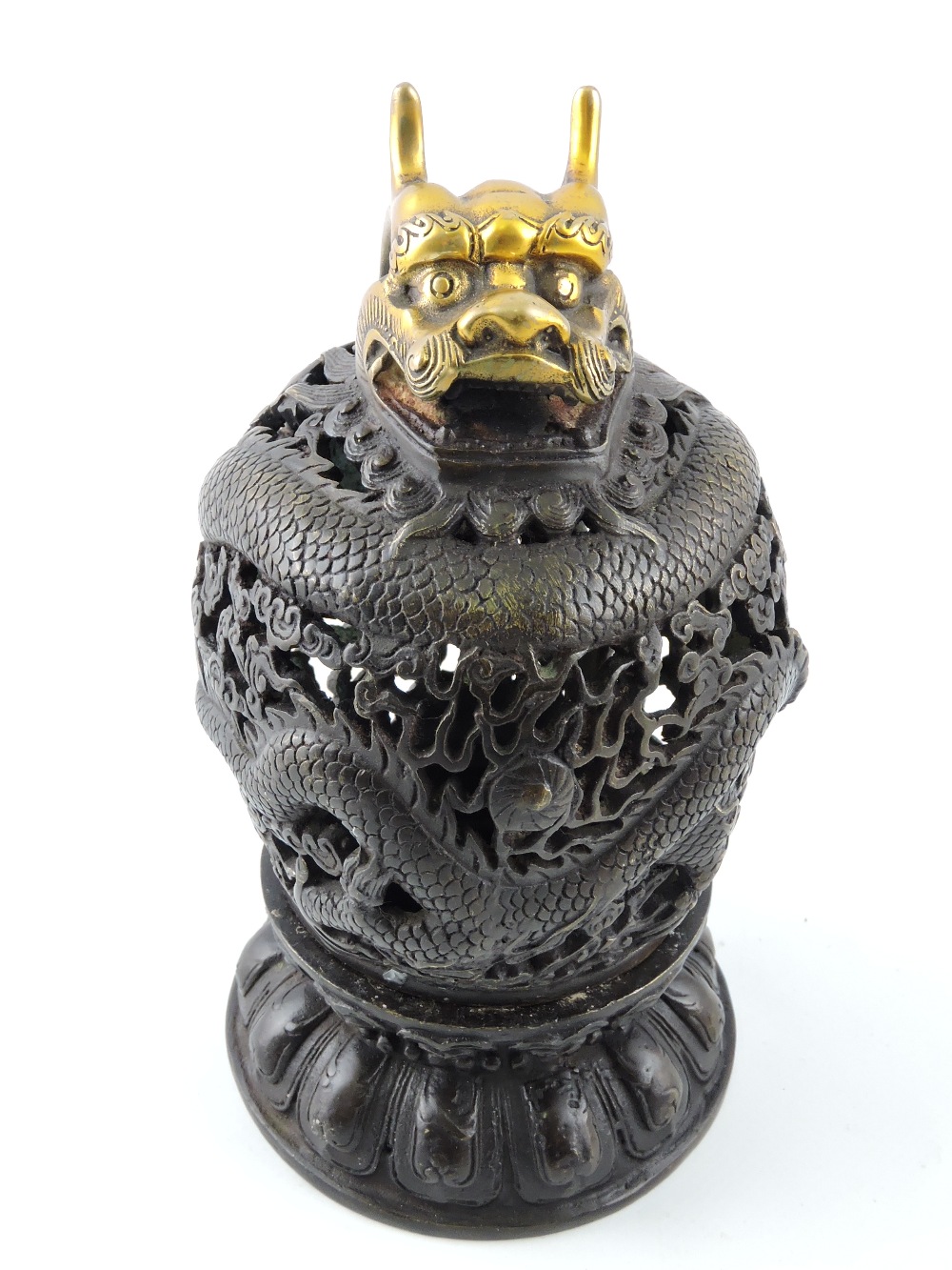 A Chinese bronze censer, pierced and cas