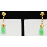 A pair of jade ear pendants, set from ye