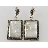 A pair of rectangular drop earrings, the