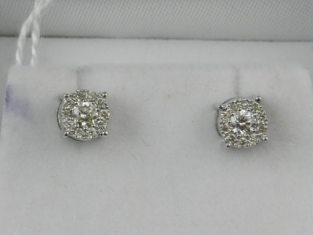A pair of 18 carat white gold and diamond multi cluster stud earrings.