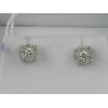A pair of 18 carat white gold and diamond multi cluster stud earrings.