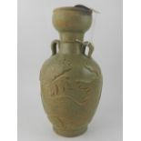 A Chinese twin-handled celadon vase, rel