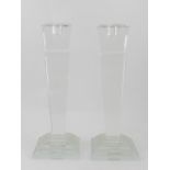 A pair of Art Deco style glass candlesticks, of square form on a stepped base. H.27.5cm