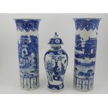 A pair of Chinese blue and white porcelain brush pots, extensively decorated with river landscape