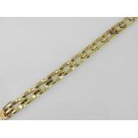 A yellow metal articulated link bracelet