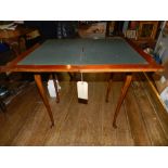 An early 20th century walnut card table,