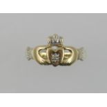 A 9 carat yellow gold Claddagh ring.