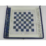 A lapiz lazuli and white marble chess se