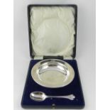 A two piece silver christening bowl and