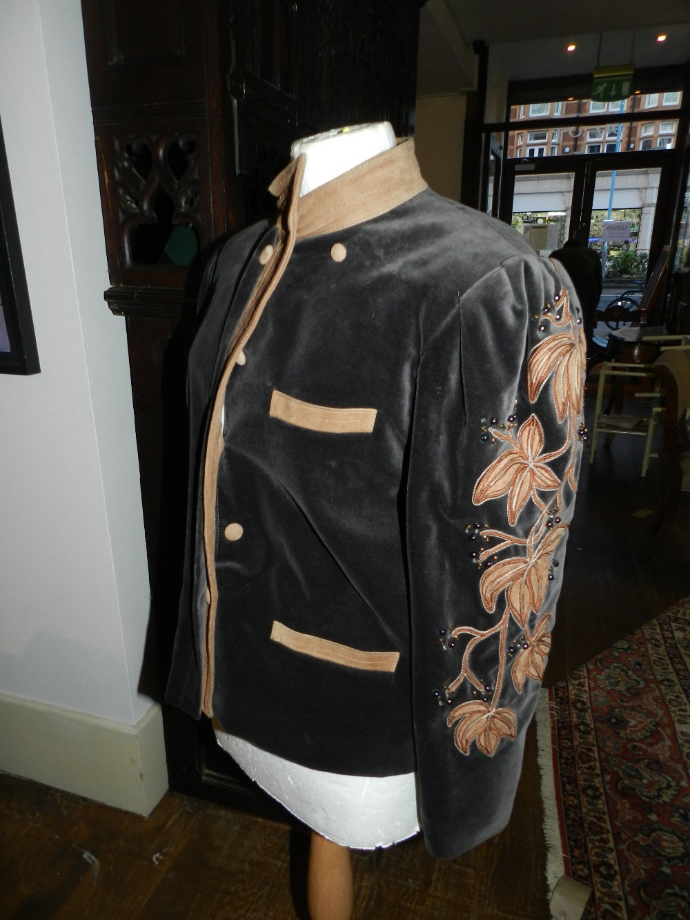 A Margaret Ley black and brown velvet jacket, having flower and beaded design to arms, size medium.