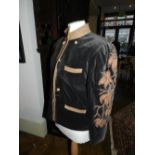 A Margaret Ley black and brown velvet jacket, having flower and beaded design to arms, size medium.