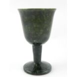 A spinach green nephrite cup with everted rim raised on a tapering column with circular spreading