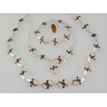 A collection of silver and amber jewelle